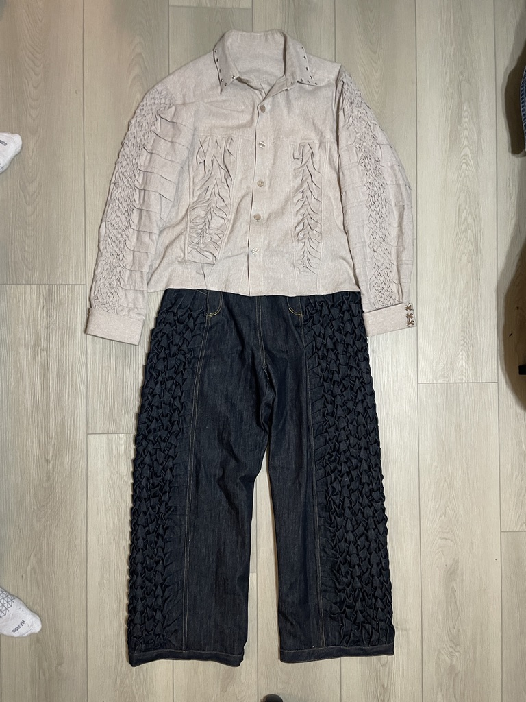 The complete Soft Armor linen shirt and Canadian-smocked denim trousers arranged as a flat lay